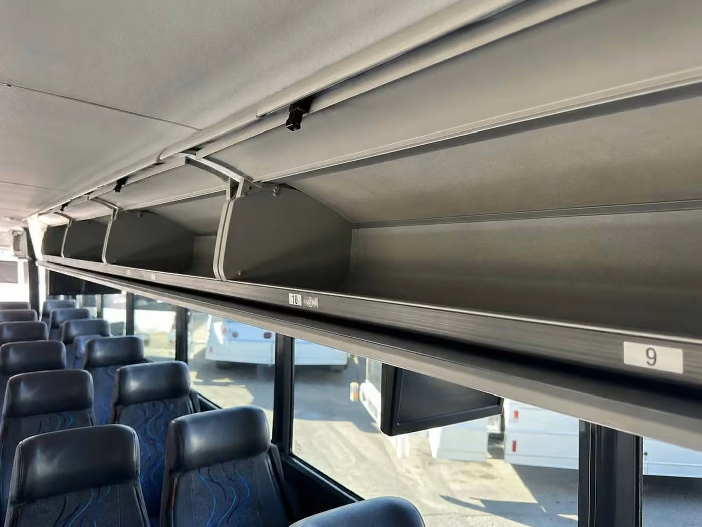 rome 56 passenger charter bus overhead storage